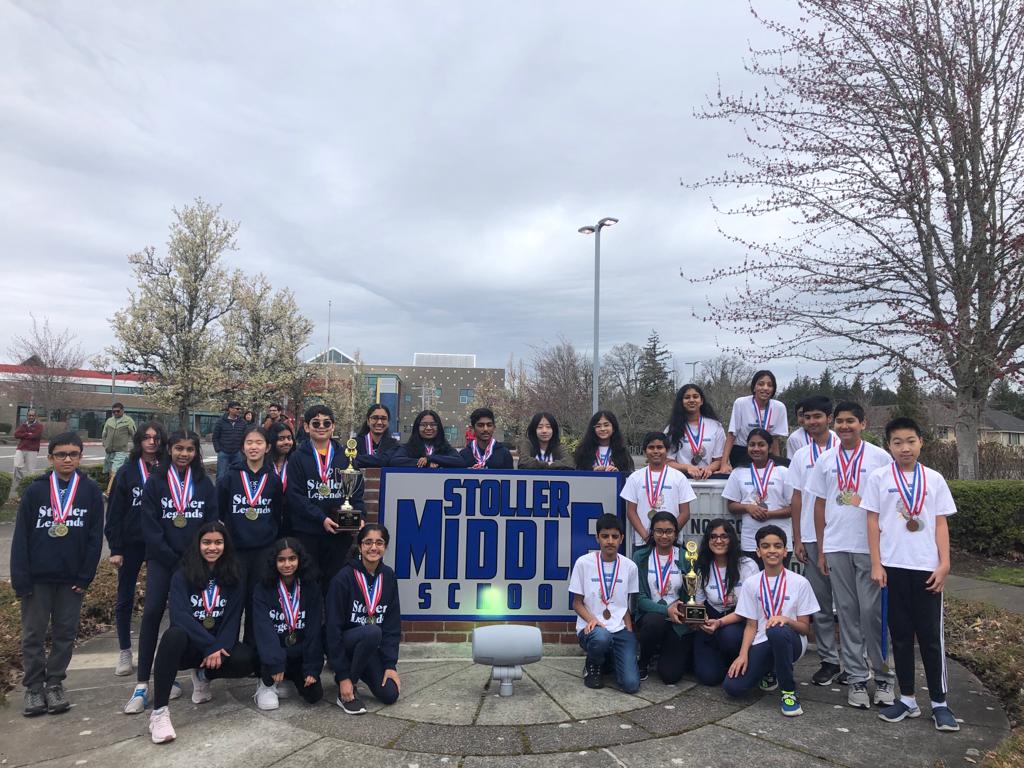 Stoller Middle School Science Olympiad team with medals and trophies